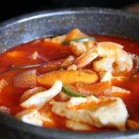 Sundubu Jjigae Soup · Spicy silken tofu stew with egg yolk.