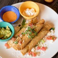 Taquitos Hidalgo · four rolled crispy taquitos with Sonora machaca beef, chipotle crema, queso fresco, and guac...