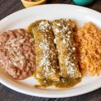 Enchiladas Zuisas · grilled tortilla filled with queso fresco, onions, topped roasted tomatillo salsa with crema...