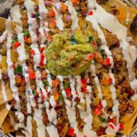 Nachos  · Fresh, made in house Chips Layered beans, meat of your choice, Melted Jack & Chedder cheese,...