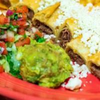 Flautas · 2 Crispy Flour tortillas filled with beef or chicken topped with fresh Mexican Cheese and a ...