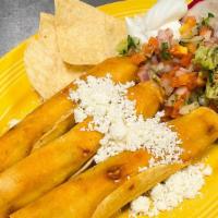Taquitos · Corn tortilla, beef or chicken, sour cream, and guacamole.