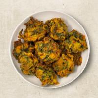 Skiny Spinach Fritters (Vegan) · Spinach chopped and mixed with bengal gram and fried in oil