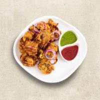 Friendly Fritters (Vegan) · Onions chopped and mixed with bengal gram and fried in oil