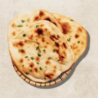 Naan Flatbread(Vegan) · Fluffy dough properly smashed and baked in an Indian oven