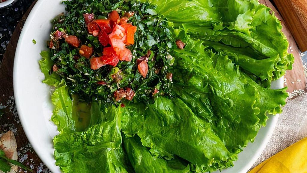 Tabouleh Salad · parsley, bulgur, green onion, tomato, mint, spices, extra virgin olive oil, lemon juice - house dressing is a mix of extra virgin olive oil, fresh squeezed lemon juice, dry mint, sumac (VG VN R)