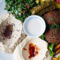 Vegetarian Entree · hummus, baba ghannouj, tabouleh, two falafel patties, grape leaf (VG). Served with pita brea...