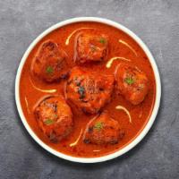 Chicken Vindaloo · Chicken cooked in rich tangy gravy with curry leaves, potatoes and coconut milk