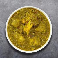 Lamb Saag · Boneless lamb cooked with blended Indian spices and spinach sauce.