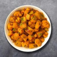 Aloo Gobi · Potato and cauliflower cooked with onion sauce.