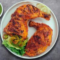 Tandoori Chicken · Marinated chicken (2 leg quarters) cooked in a clay oven served with mint sauce.