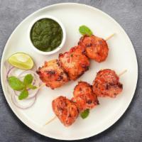 Malai Chicken Tikka Kabab · Chicken breast meat marinated with cream and yogurt and cooked in a clay oven served with mi...