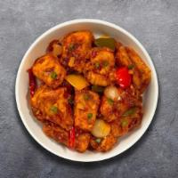 Chili Paneer · Batter fried Indian cottage cheese tossed with onion, peppers and hot garlic sauce.