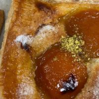 Apricot Almond · Puff Pastry dough with Frangipane filling, topped with 2 Apricot halves and some Pistachios ...