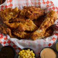 The Four Pack · Eight seasoned fried chicken strips, 4 sides of your choice, 6 sauces of your choice, and 4 ...