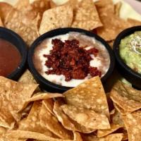 Chips And Dip Trio · Enjoy our chori-queso bean dip, guacamole, and house salsa with an order of chips.