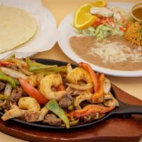 Fajita Mixta · Includes rice and beans and meat with grilled bell peppers, tomatoes, and onions. Served wit...
