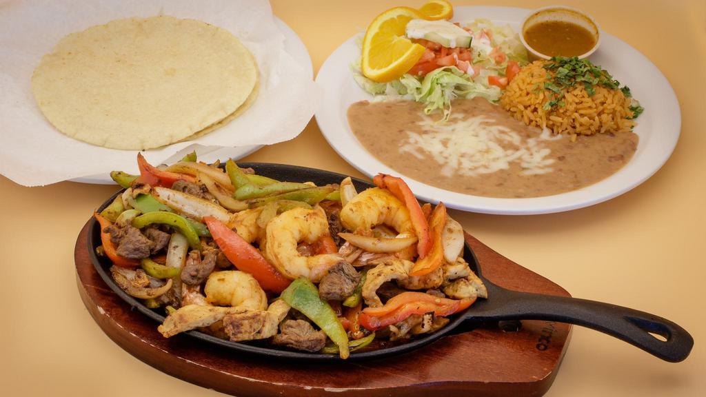 Fajita Mixta · Includes rice and beans and meat with grilled bell peppers, tomatoes, and onions. Served with flour or corn tortillas, Pico de gallo, guacamole, and sour cream.