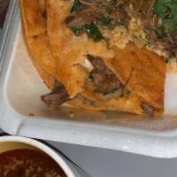 1 Queso Birria Taco · Red sauce beef stew taco with cheese, onion and cilantro.