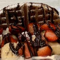 Strawberry Banana Waffle · Waffle topped with strawberry, banana, syrup, and whipped cream.
