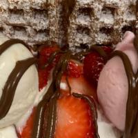 Strawberry Banana  Ice Cream Sandwich · Waffle topped with 2 scoops of ice cream, banana, strawberry, chocolate syrup and whipped cr...