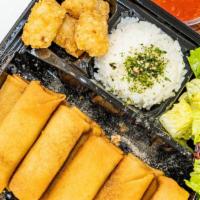 Crispy Egg Roll Bento Box · Veggie Egg Roll with steam rice green salad and potato tots.