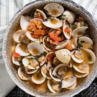 Steamed Clams · Steamed clams, sautéed with fresh garlic and tomatoes in a delicious white wine sauce.