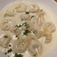 Tortelloni Alfredo · Served with our homemade Parmesan cream sauce.