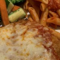 Chicken Parmigiana · Breaded chicken breast, baked with Mozzarella cheese and our house marinara.