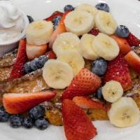 San Diego French Toast · Grilled until golden brown and garnished with the freshest sliced bananas, strawberries, and...