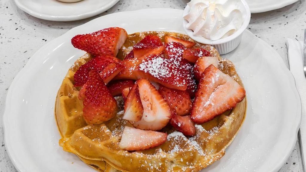 Fresh Strawberry Patch Waffle · A waffle dusted with powdered sugar, topped with fresh strawberries, served with real whipped cream and whipped butter.