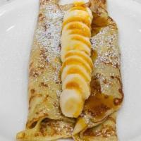 Banana Crepes · Ripe bananas, sour cream and a splash of Triple Sec gently stuffed into crepes; topped with ...