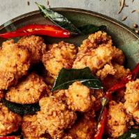 Popcorn Chicken · Served with a side of sweet and sour sauce