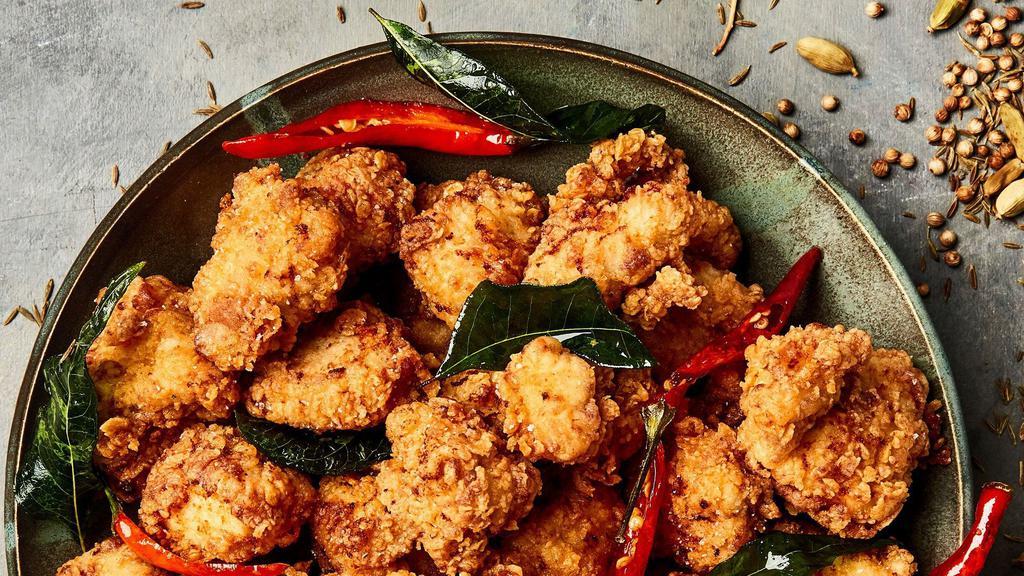 Popcorn Chicken · Served with a side of sweet and sour sauce