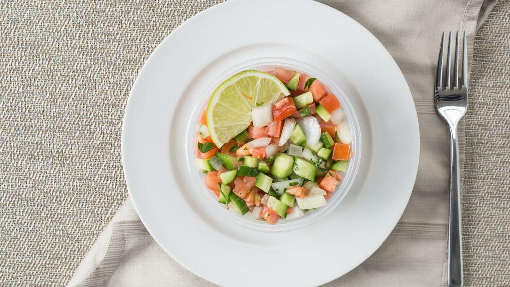 Shirazi Salad · Combination of fresh chopped cucumbers, tomatoes, parsley, onions with virgin olive oil and fresh lime juice dressing.