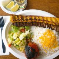 Beef Koobideh · Two skewers of juicy charbroiled, seasoned ground beef, served with charbroiled tomato and i...