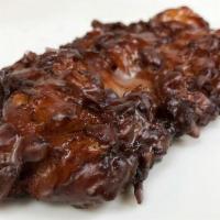 Vegan Apple Fritter · Our top seller. Cinnamon apple chunks chopped into yeast raised dough and fried until golden...