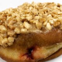Vegan Pb&J · Yeast raised dough filled with strawberry jelly, topped with house peanut butter cream and c...