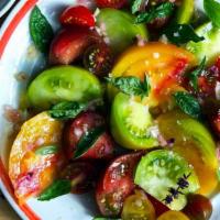 Heirloom Tomato Salad · baby arugula, basil vinaigrette, Za'atar.