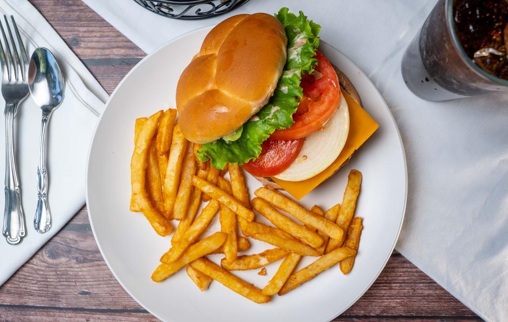 Grill'N Cheeseburger · Cheddar cheese, crisp lettuce, fresh tomato, onion and special sauce. Made with fresh 100% certified angus beef and served with choice of side.
