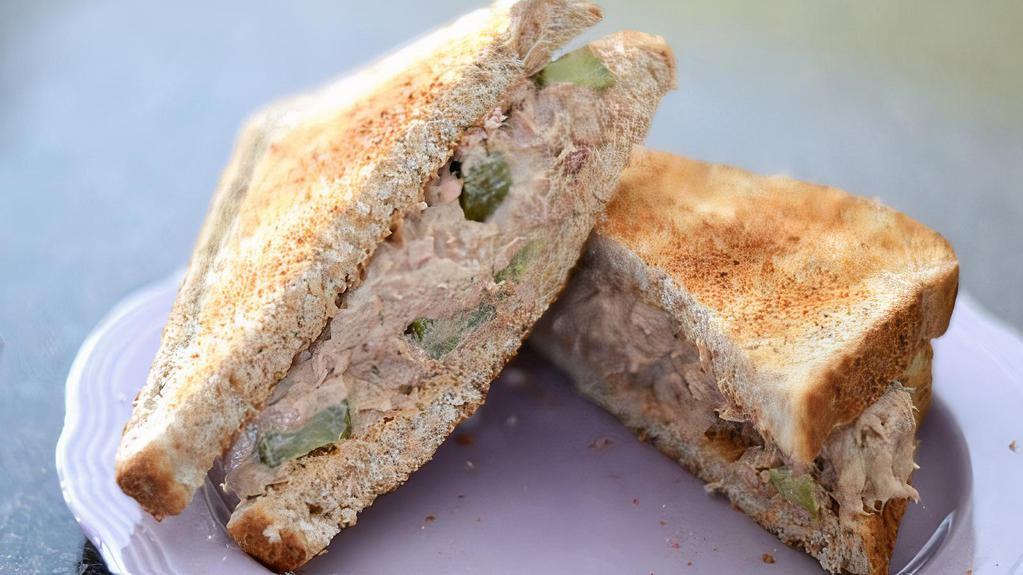 Tuna Salad Sandwich · Perfectly, seasoned premium white albacore tuna salad, crisp lettuce and mayonnaise on sourdough bread. Served with choice of side. 600-860 Cal.