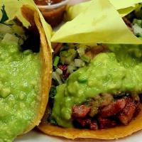 Tacos · Soft corn tortilla. Your choice of meat topped with onion, cilantro, fresh salsa and guacamo...