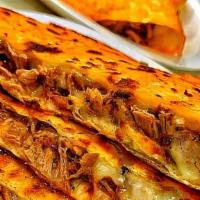 Quesadillas · Large flour tortilla turn over. Cheese, your choice of meat, onion, cilantro, fresh salad an...