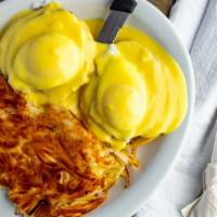 Eggs Benedict · Two eggs poached, sliced ham on top of an english muffin and topped off with a hollandaise s...