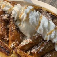 Banana Foster · Grilled bananas, walnuts, caramel sauce, topped with whipped cream and powdered sugar. Serve...