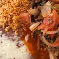Steak Picado · Served with rice beans and tortillas.