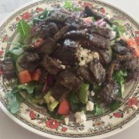 Gyros Salad · Greek salad topped with beef and lamb gyros.