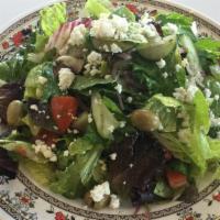 Greek Salad · Vegetarian. Mixed greens, lettuce, tomatoes, cucumbers and onions topped with Feta cheese an...