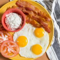 Low Carb Breakfast · Three eggs with your choice of bacon or sausage, or sliced ham. Served with cottage cheese a...