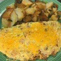 Hobo Omelet · Bacon, sausage, ham, onions, bell peppers, tomatoes, and cheese. Prepared with three eggs. S...